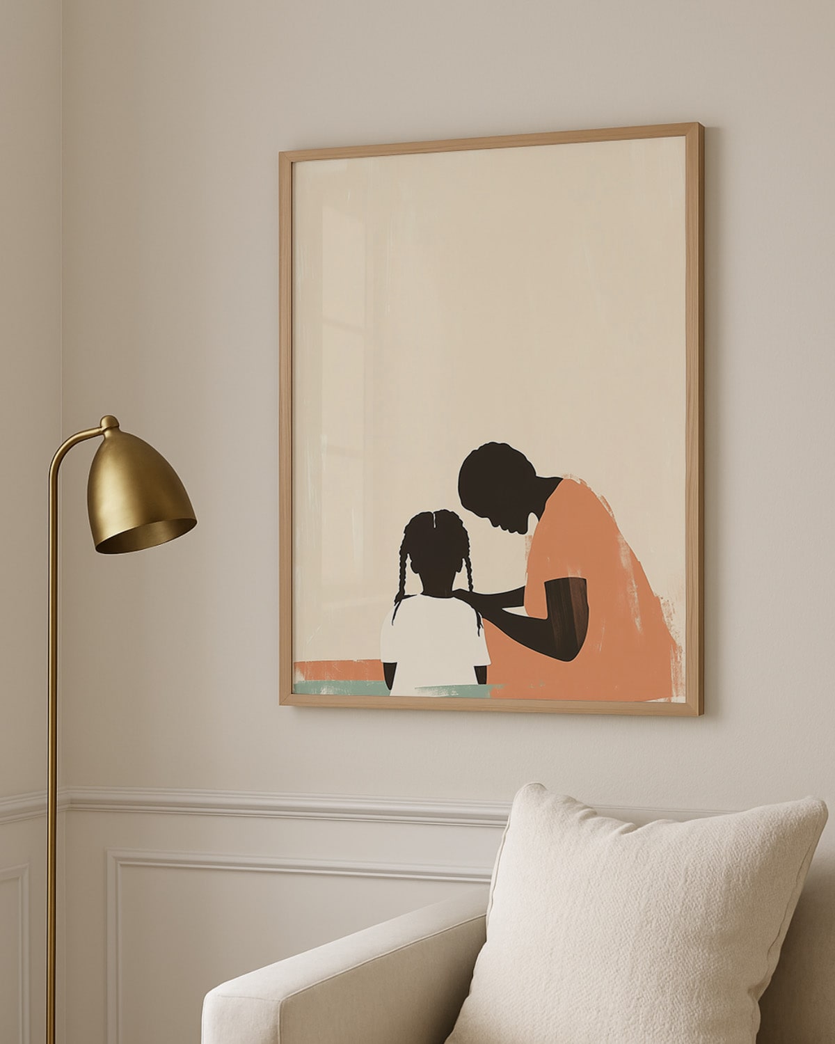 Framed artwork of a woman and child on a wall with a gold lamp and white chair.