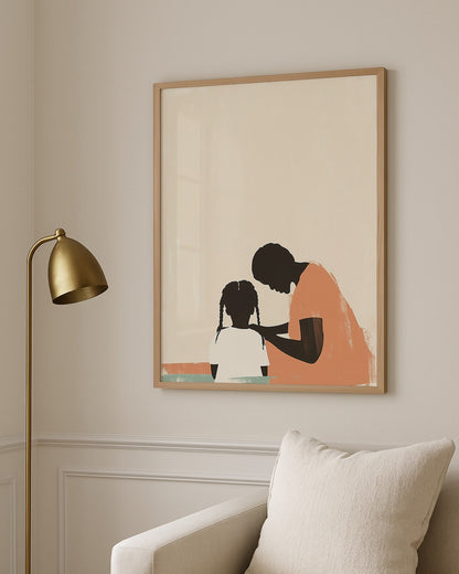 Framed artwork of a woman and child on a wall with a gold lamp and white chair.